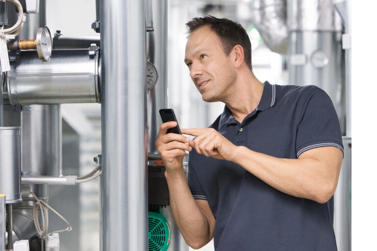 Installer Sascha working in boiler room
