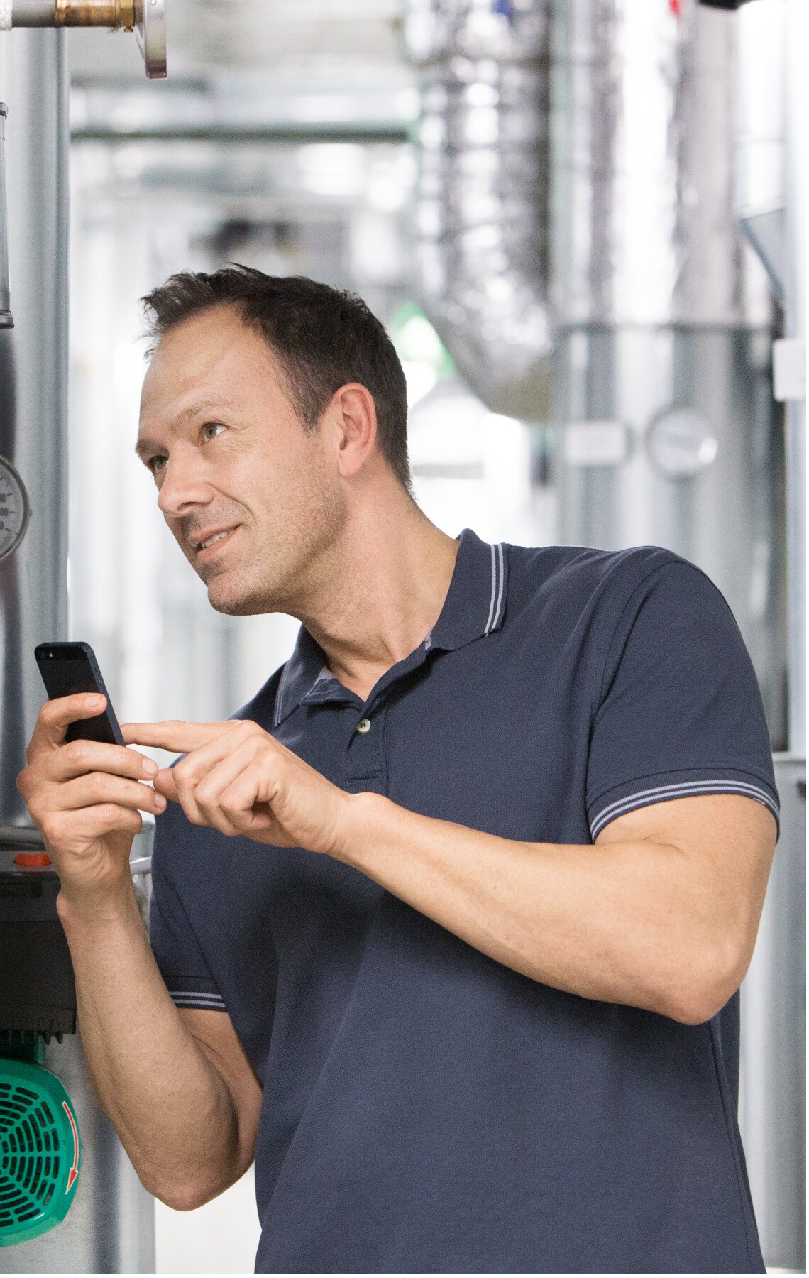 Installer Sascha working in boiler room