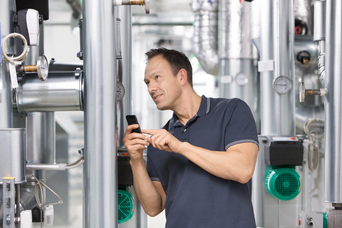 Installer Sascha working in boiler room