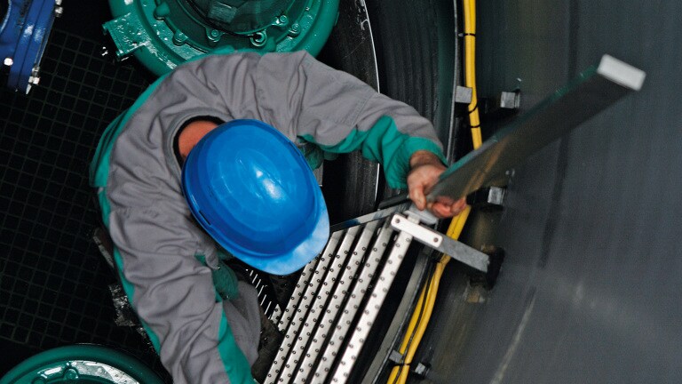 Man in Wilo-EMUport solids separation system, Usedom, Germany