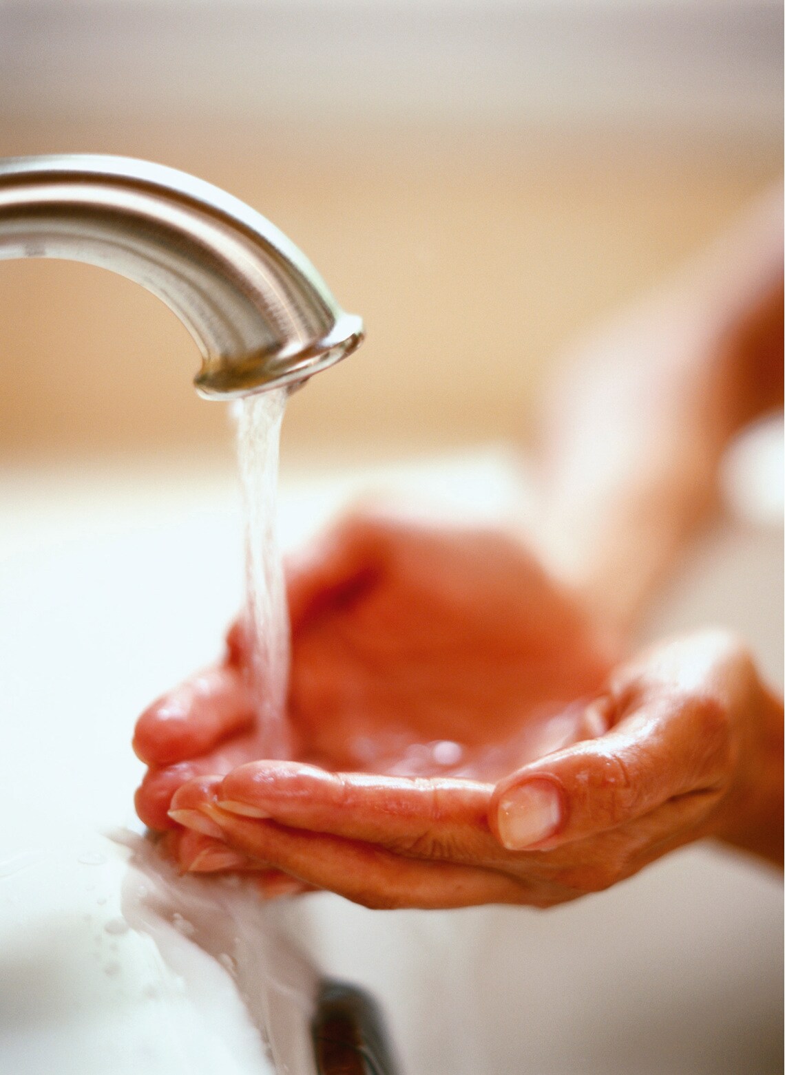 Hands under tap
