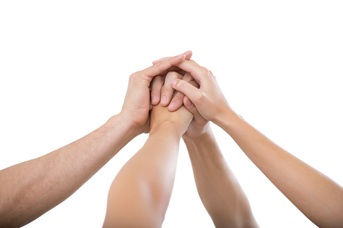 Hands raised together