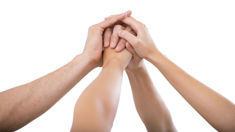 Hands raised together