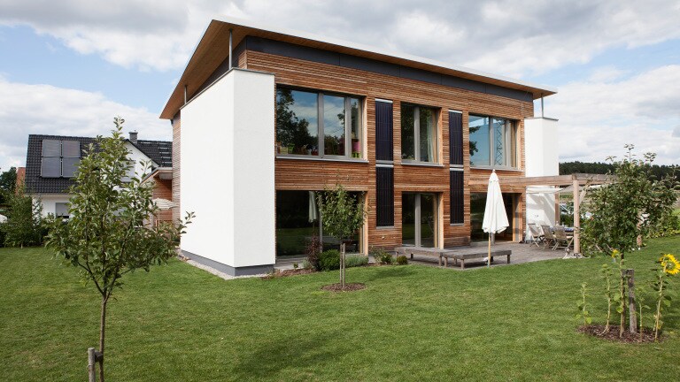 One-family house in Bavaria, Nuremberg. View of modern house with garden.