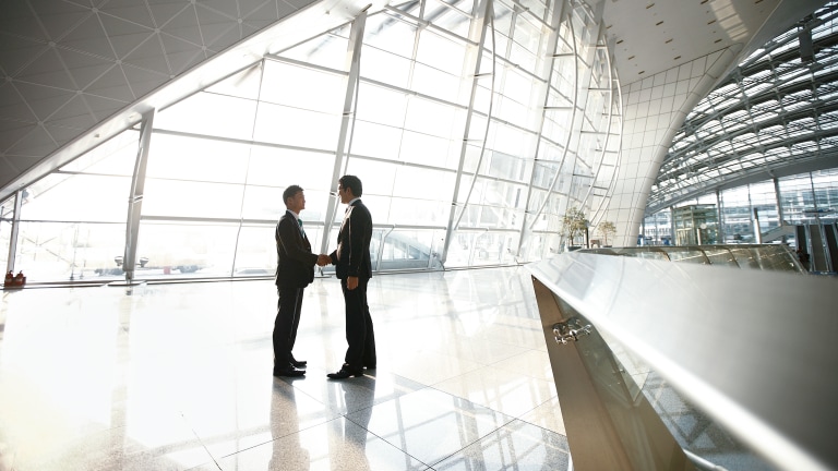 Handshake in entrance hall of the incheon international airport