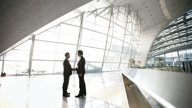 Handshake in entrance hall of the incheon international airport
