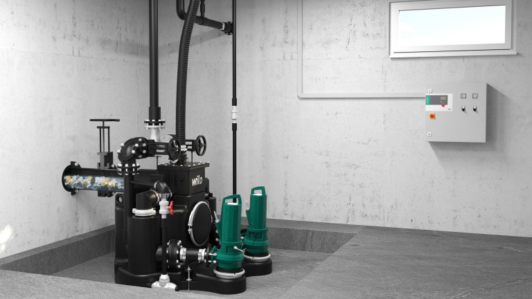 Wilo-EMUport CORE installiert im Gebäude/Keller mit Wilo-Schaltgerät, hoher Anteil an Feststoffen im Abwasser sichtbar